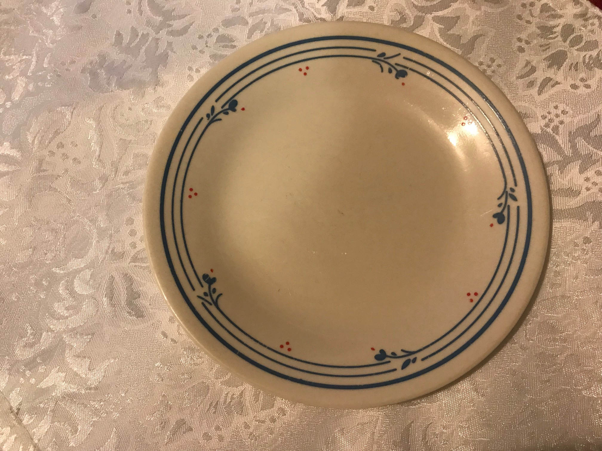 Small Cream Corelle Plate With Blue Floral Border & Red Berries: 7,450 ppm Lead + Cadmium