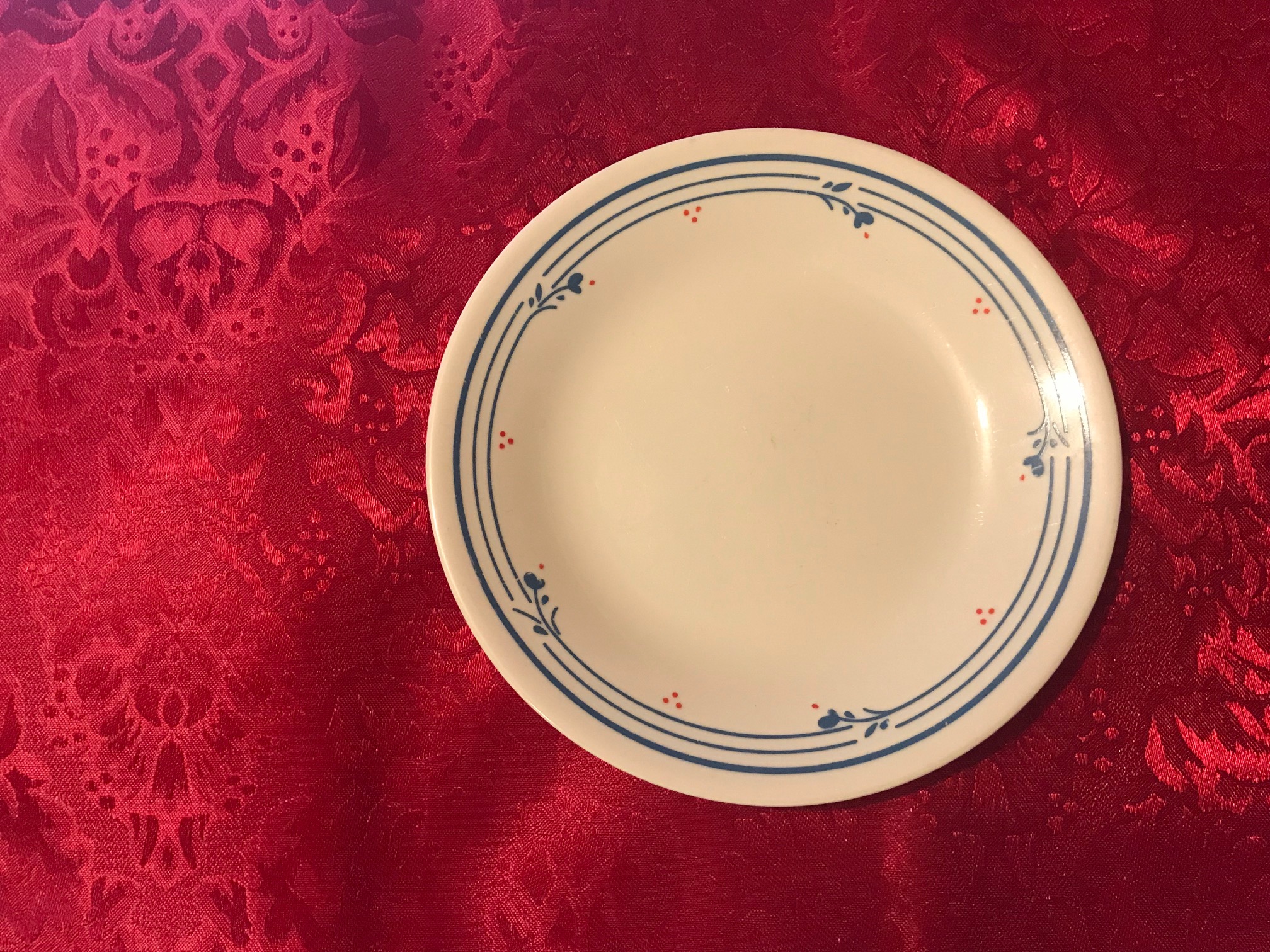 Small Cream Corelle Plate With Blue Floral Border & Red Berries: 7,450 ppm Lead + Cadmium