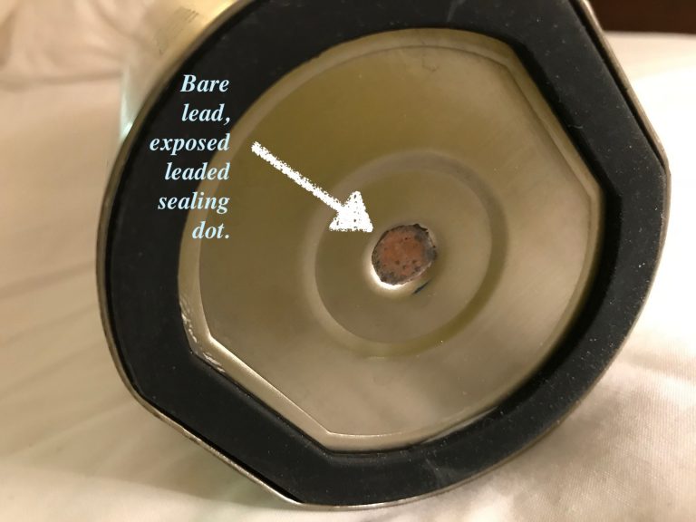 This is what a Leaded sealing dot looks like on a stainless steel water bottle. Please read the full piece if you have questions.