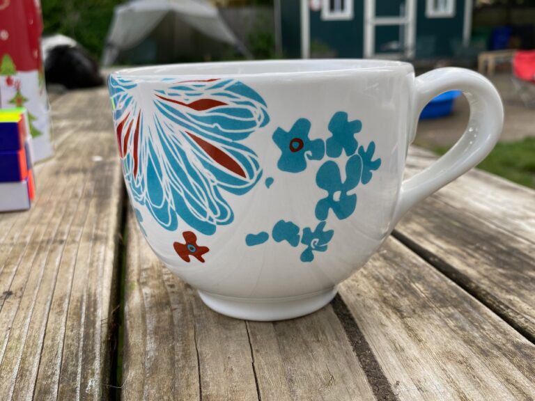 Ikea mug with blue & red floral design, made in Thailand. Item 15199: Lead-free, Cadmium-free, Arsenic-free, Antimony-free.