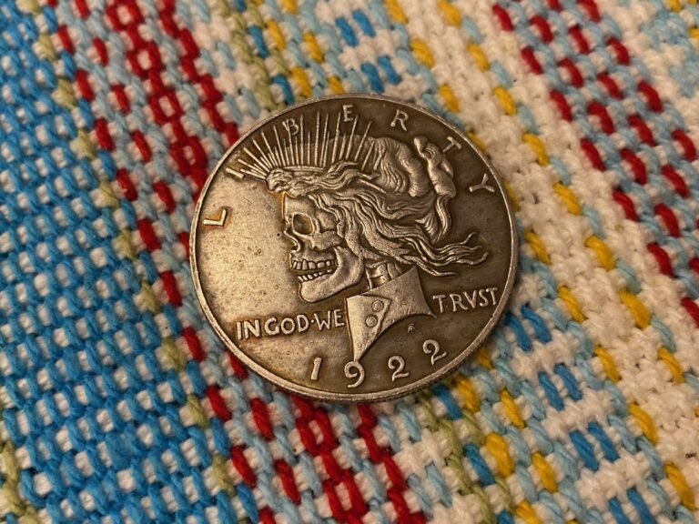 Faux 1922 Peace silver dollar with skeleton head: 1,639 ppm Arsenic. Please don’t use collectable coins as fidgets.