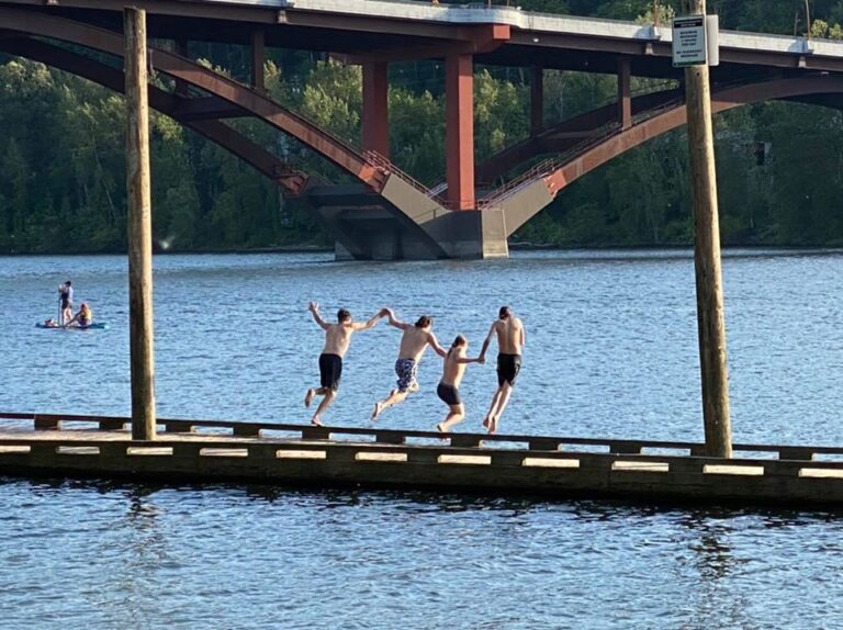 A post to share a little joy today… this photo is of all four of my sons jumping off the dock at the river near our home.