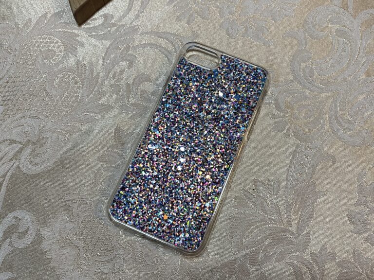 Dollar Store clear plastic phone case with glitter: Lead-free, Cadmium-free, Arsenic-free, Mercury-free.