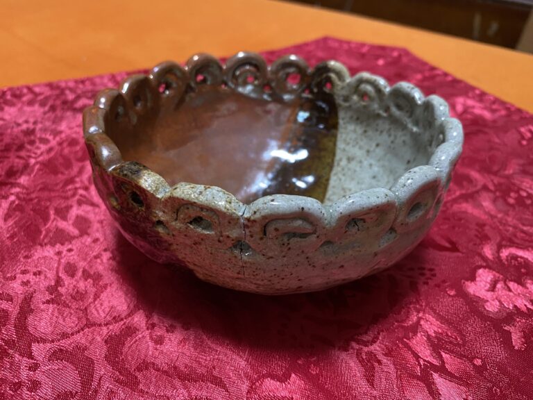 Handmade ceramic bowl with red, brown and gray glaze: Lead-free glaze + trace Lead in the substrate.