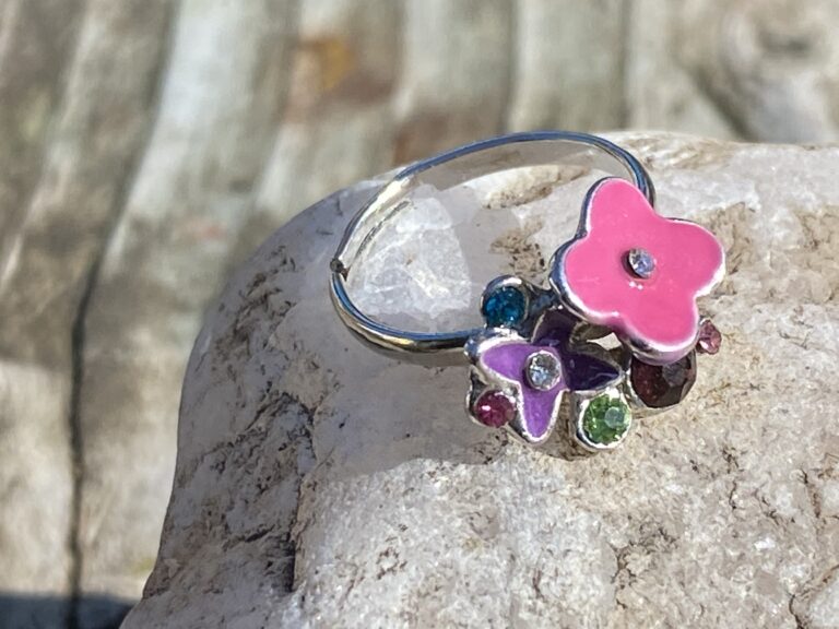 Paparazzi Accessories child’s ring – pink & purple enamel flowers, with gems: 38,900 ppm Lead & 334,900 ppm Cadmium (illegal in California) & 6,603 ppm Antimony.