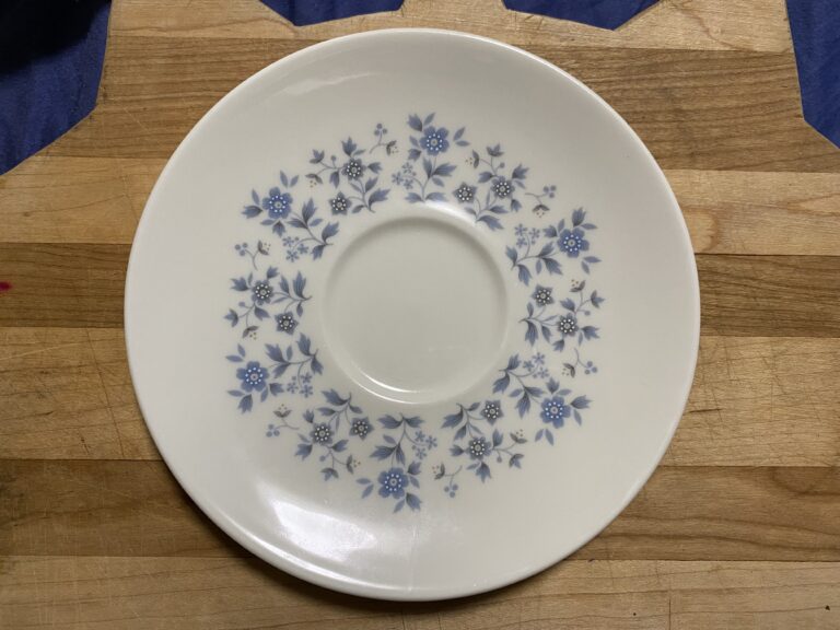 Royal Doulton Galaxy Saucer with blue floral design (c. 1960-1974): 45,000 ppm Lead on the food surface.